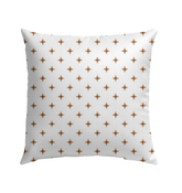 Elegant Flowing Peaks outdoor pillow in a garden setting.
